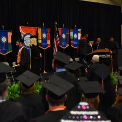 Students in regalia face the stage during ChattState's Spring 2022 graduation.