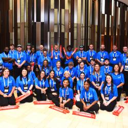 group of people in blue polo shirts