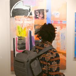 A student looks at a piece of art in the Denise Heinly art center on Chattanooga State's campus.