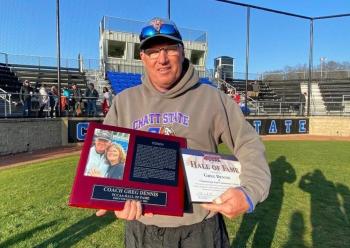 Greg Dennis a holding TCCAA Hall of Fame plaque. Greg Dennis a holding TCCAA Hall of Fame plaque.