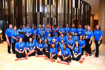 group of people in blue polo shirts