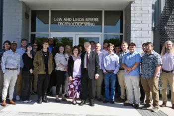 Myers Technology Wing Lew and Linda Myers surrounded by students at the opening of the Myers Technology Wing