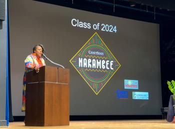 Kisha Thomas, Director of Recruiting & Orientation, speaks during the Harambee ceremony. Kisha Thomas, Director of Recruiting & Orientation, speaks during the Harambee ceremony.